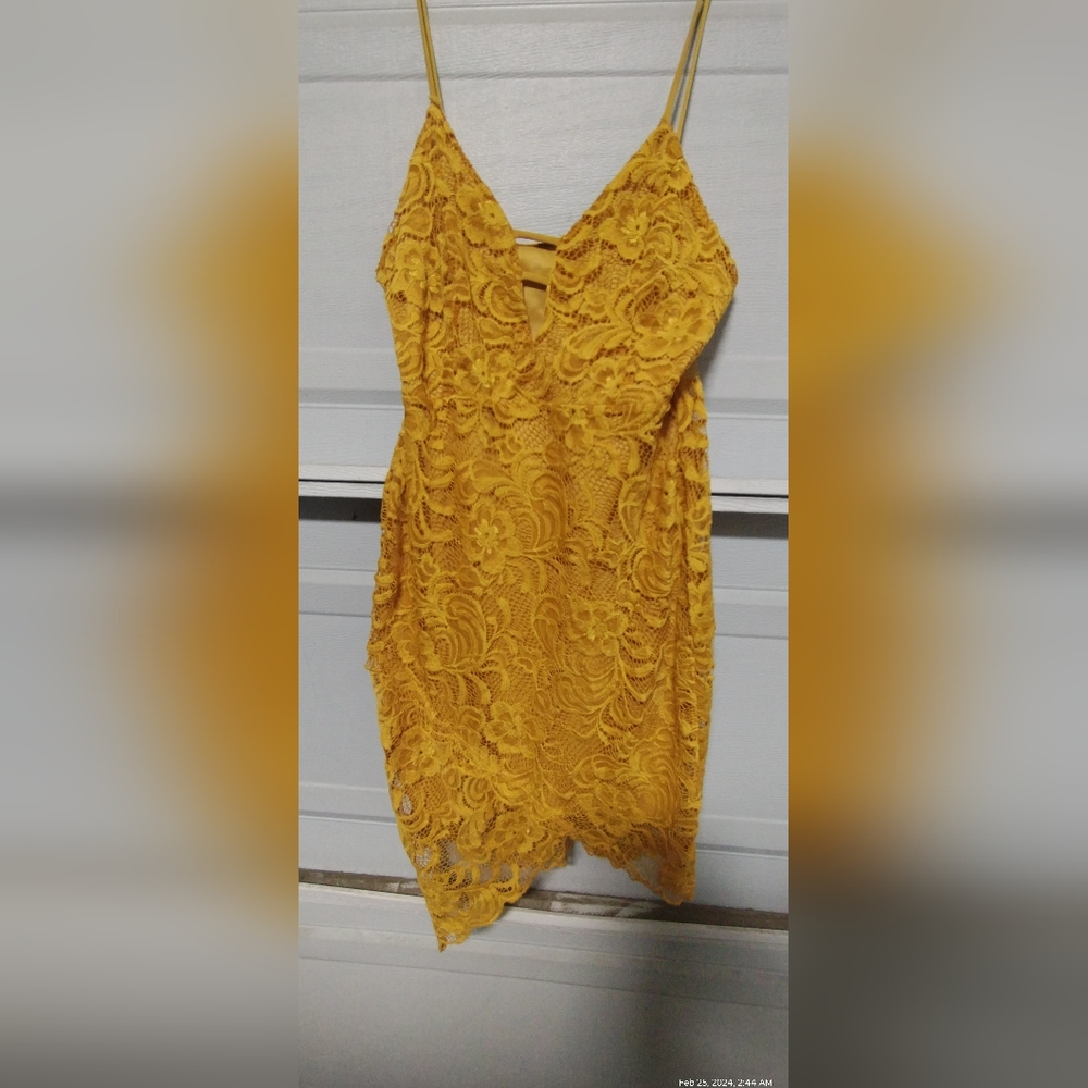 Woman's golden lace overlay dress